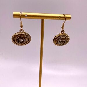 Gold tone oval vintage style earrings with rhinestones accents